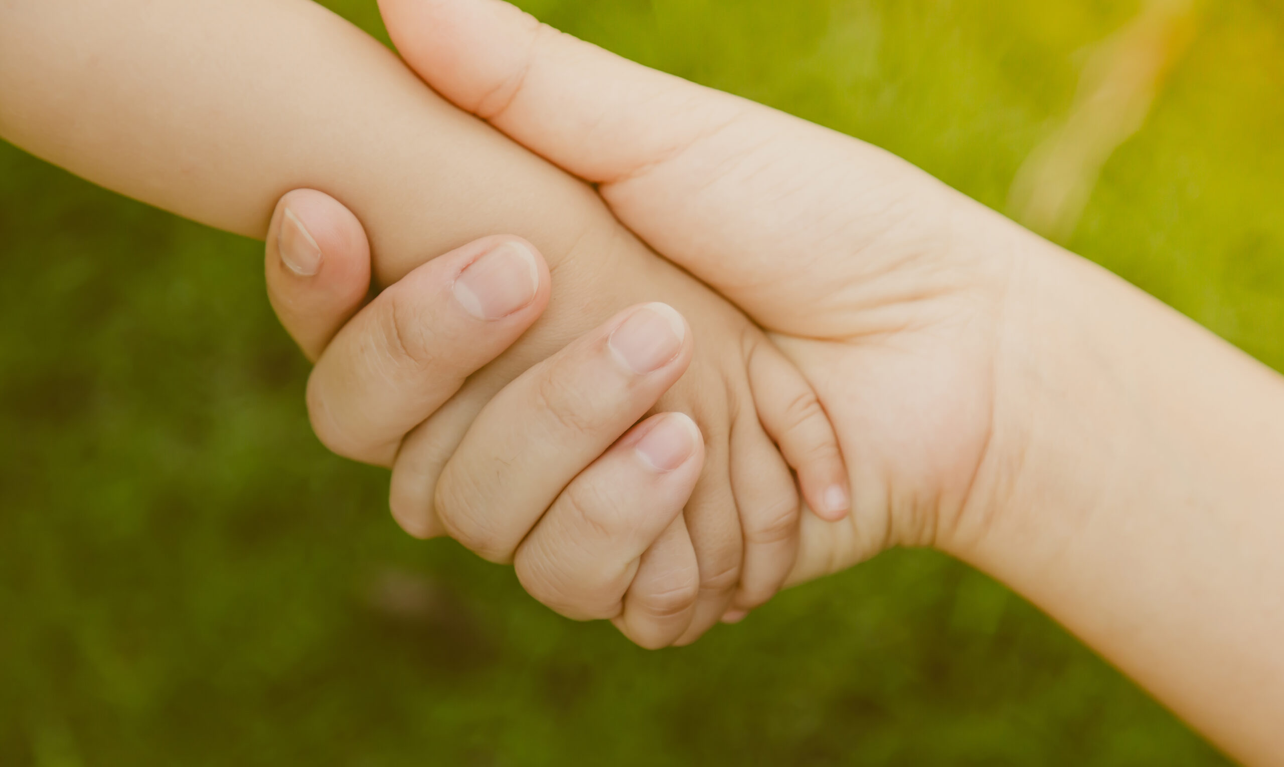Mother holding baby hand ( Filtered image processed vintage effe